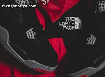 Black athletic shoes are placed alongside red and black sportswear bearing logos from Spalding and The North Face.